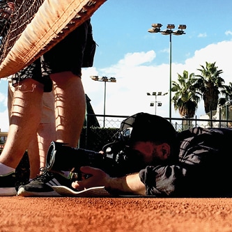 An image of a photographer lying on the floor taking a picture