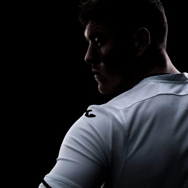 A photograph of Swansea City player from behind