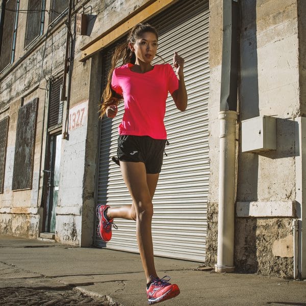 Female runner in LA wearing pink Joma kit