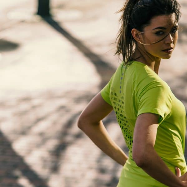 Runner wearing a yellow Joma T-shirt