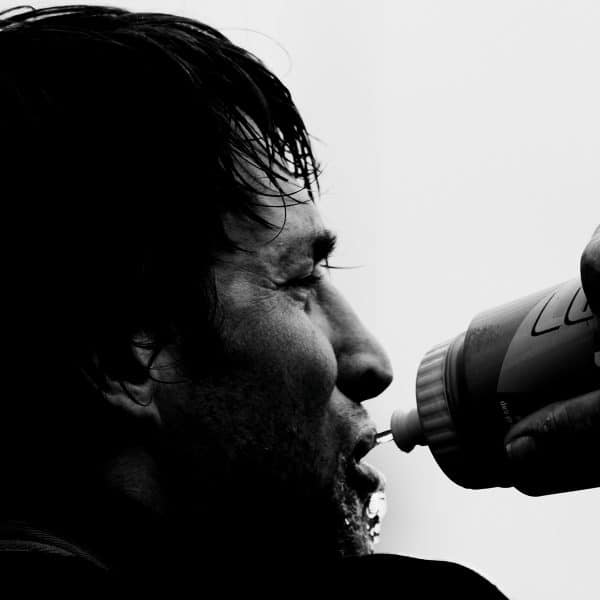 Close up of a rugby player drinking from a bottle