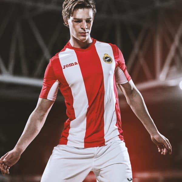 Football player in red and white striped football kit