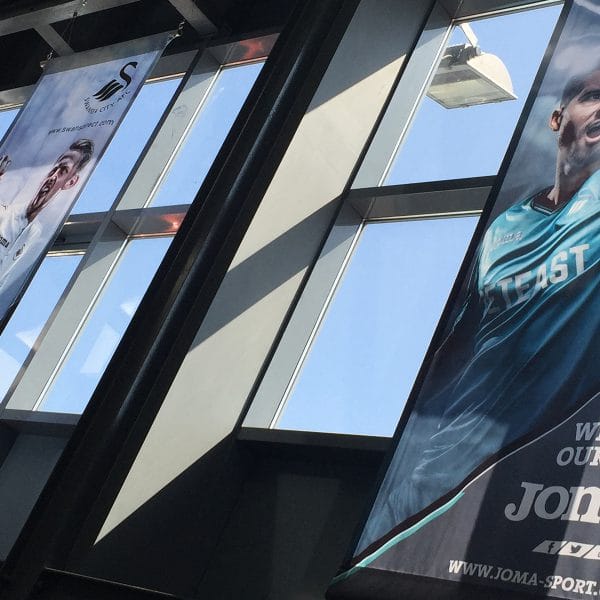 Swansea City AFC retail store giant hanging banners showing players in the new kit