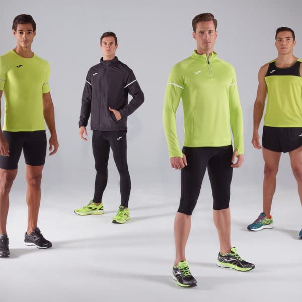 Four men wearing Joma fitness clothes on a photoshoot