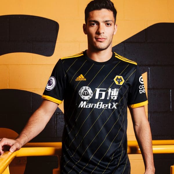 An image of a Wolves player in the away kit
